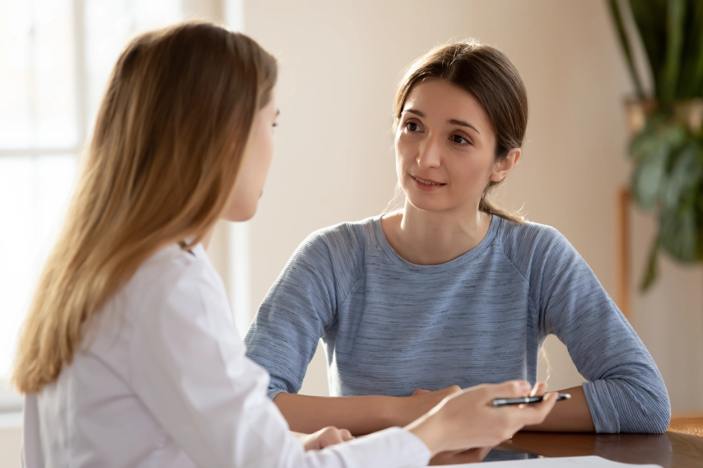 Two women having a conversation.
