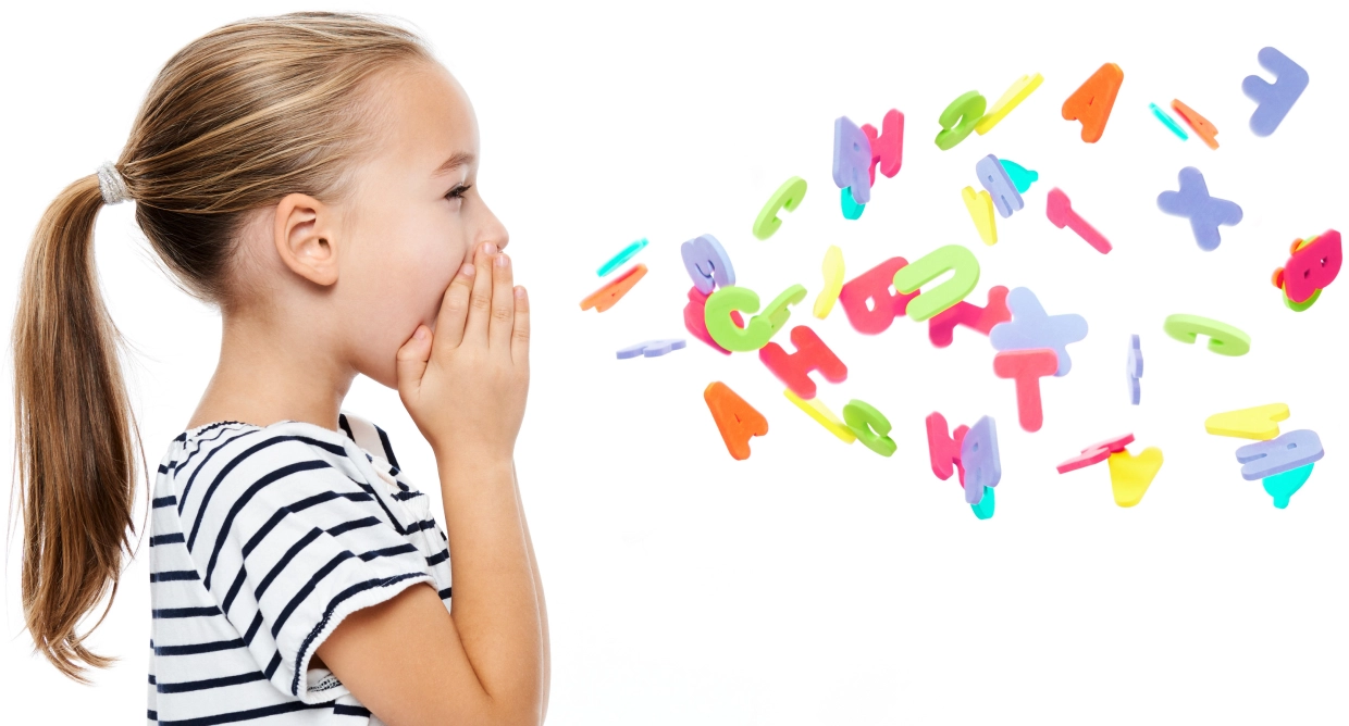 Girl whispering colorful alphabet letters.